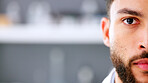 Face of serious young male in a high stress environment. Closeup of a business man head with a beard feeling anxious and stressed about work. Nervous office employee worried and looking forward.