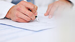 Doctor writing a prescription on paper for a patient at the hospital. Closeup of the hands of a healthcare professional drafting a medical letter or form. A GP filing a document in an office