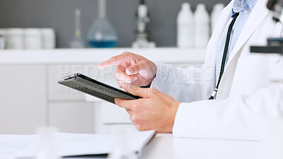 Laboratory scientist scrolling on a digital tablet and examining a dna test reaction to monkeypox virus during medical research. Biochemical engineer searching for a breakthrough cure on technology