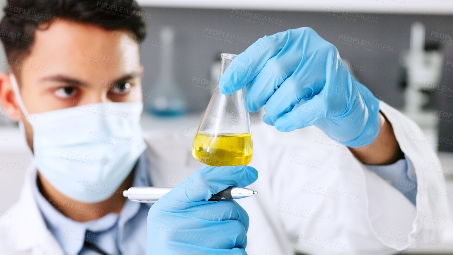 Buy stock photo Chemical liquid, beaker or scientist in a lab for chemistry results, healthcare research or scientific test. Man, mask or medical doctor with acid solution for medicine development, biology or drugs