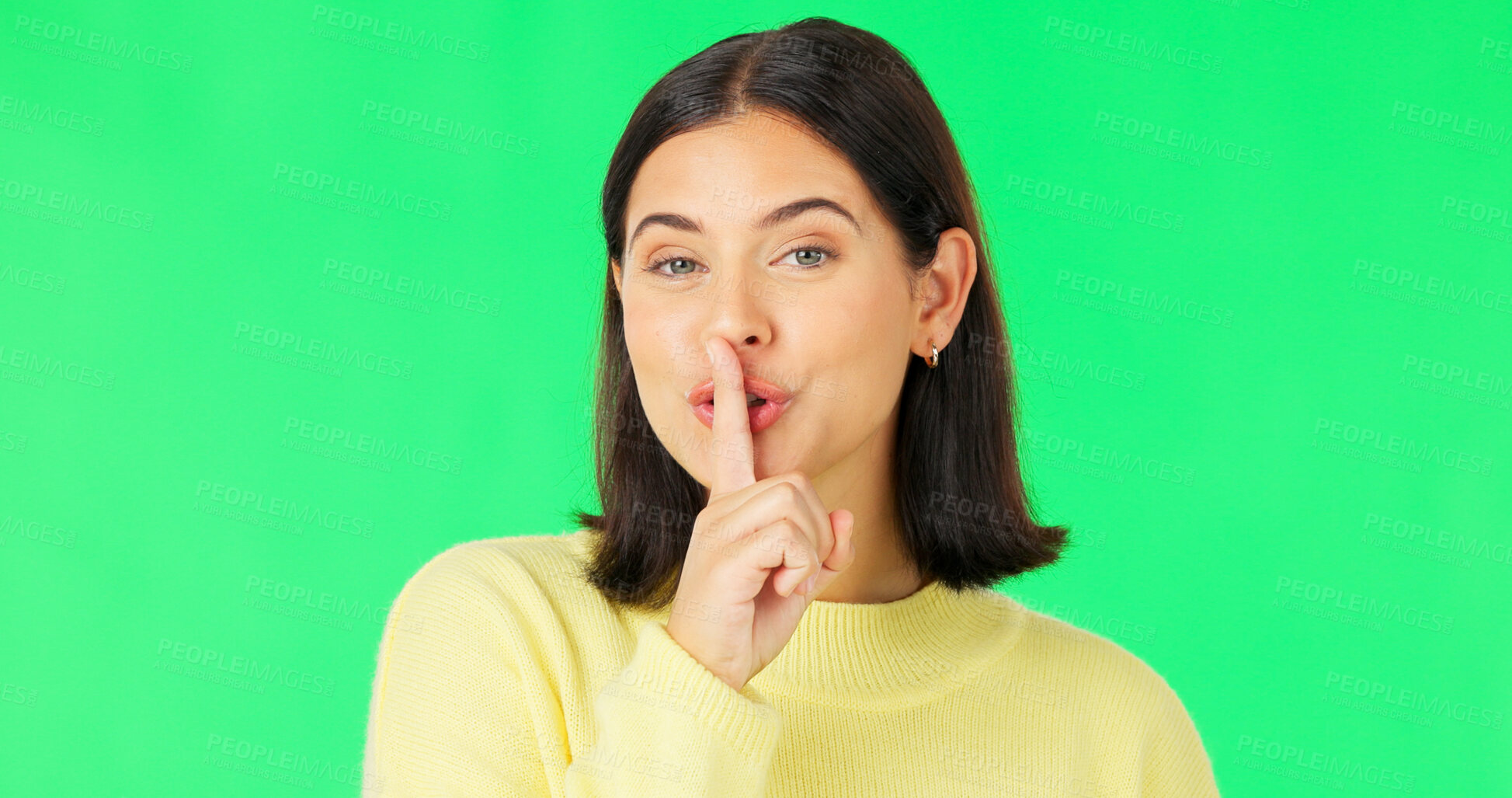 Buy stock photo Secret lips, portrait and woman on green screen for sign, privacy and drama on studio background. Happy young model show quiet for gossip, whisper and emoji of mystery sale, confidential news or deal