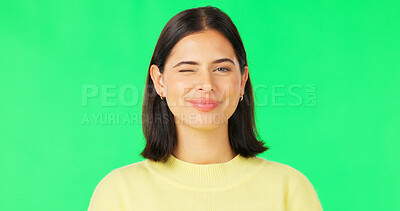 Buy stock photo Wink, portrait and face of woman on green screen with confident personality, pride and expression of joy on mockup studio background. Happy young model blink for secret, good mood and flirting emoji