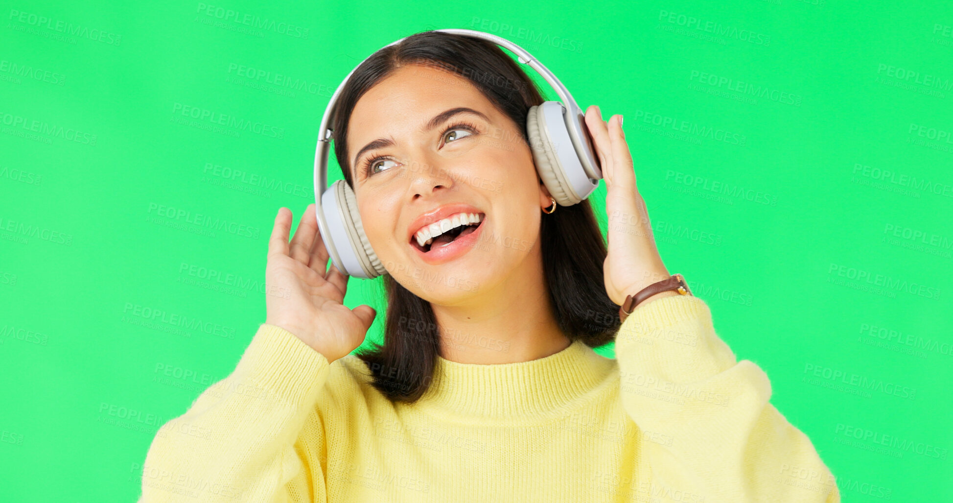 Buy stock photo Green screen, happy and woman with music headphones for celebration of freedom, party and hearing audio song on studio background. Young model listening to multimedia, sound and radio subscription 