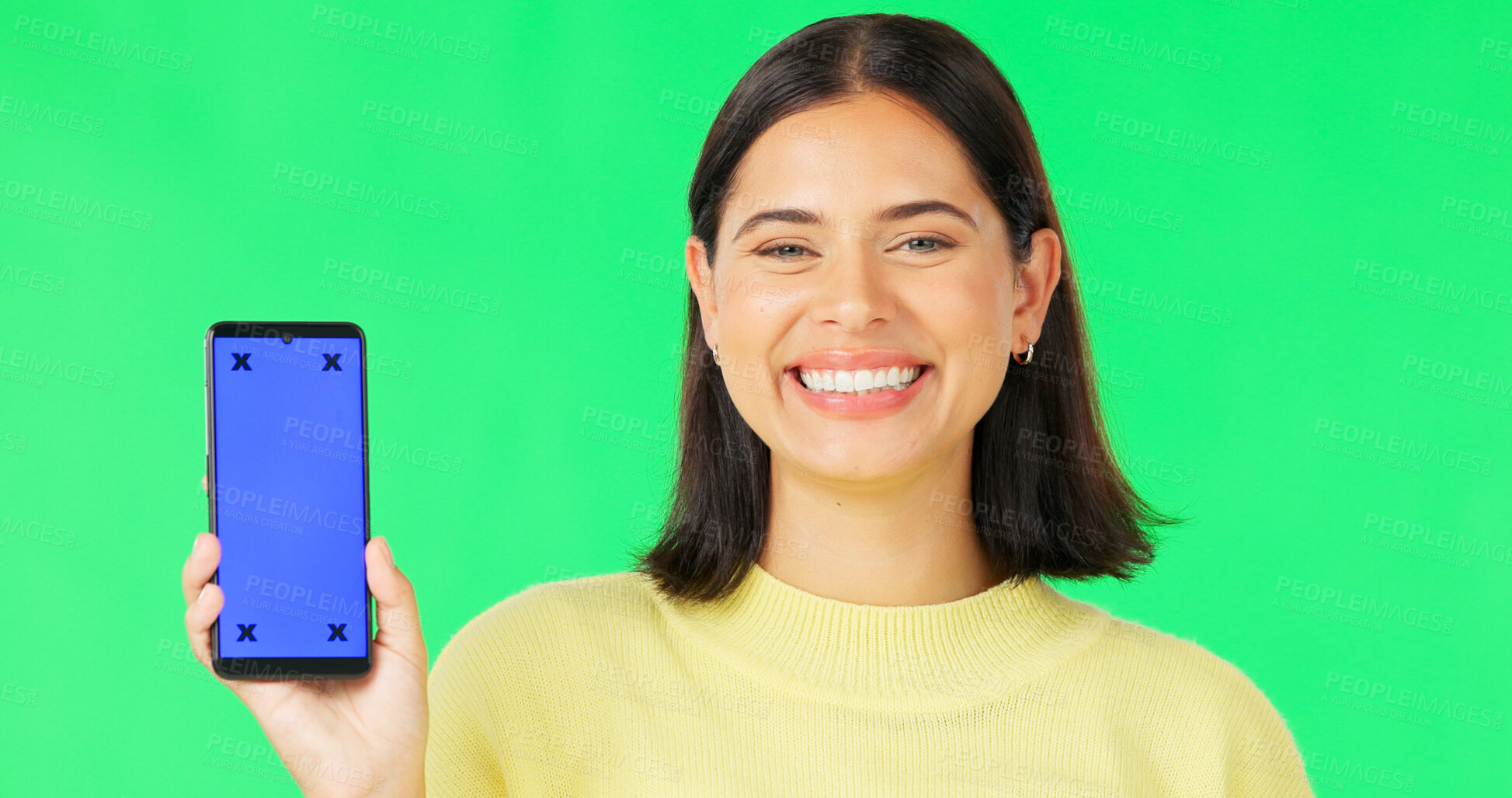 Buy stock photo Portrait, green screen and woman with a smartphone, showing and promotion on a studio background. Face, person and model with a cellphone, tracking markers and smile with mobile user and digital app