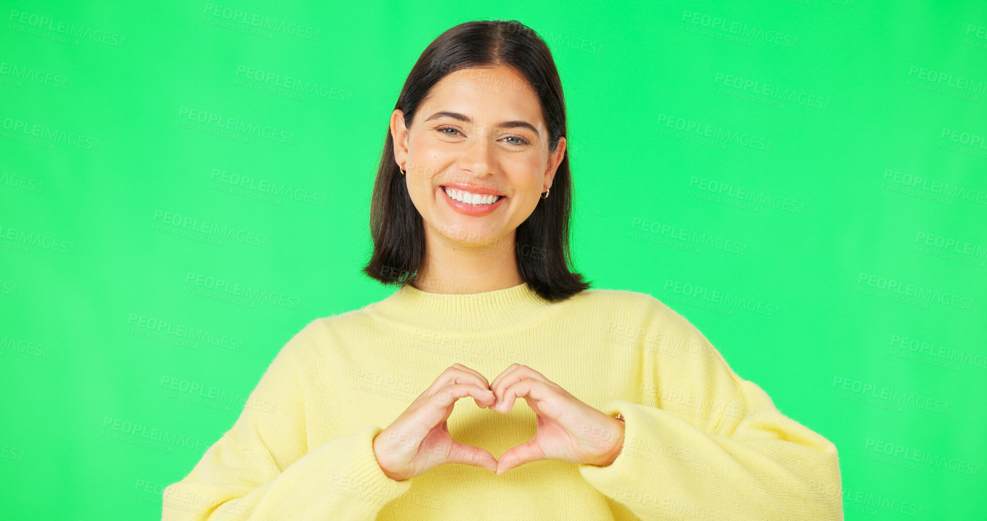 Buy stock photo Heart, hands and portrait of woman on green screen for kindness, care and charity donation on studio background. Happy young model show sign of love, hope and thank you for support, emoji and opinion