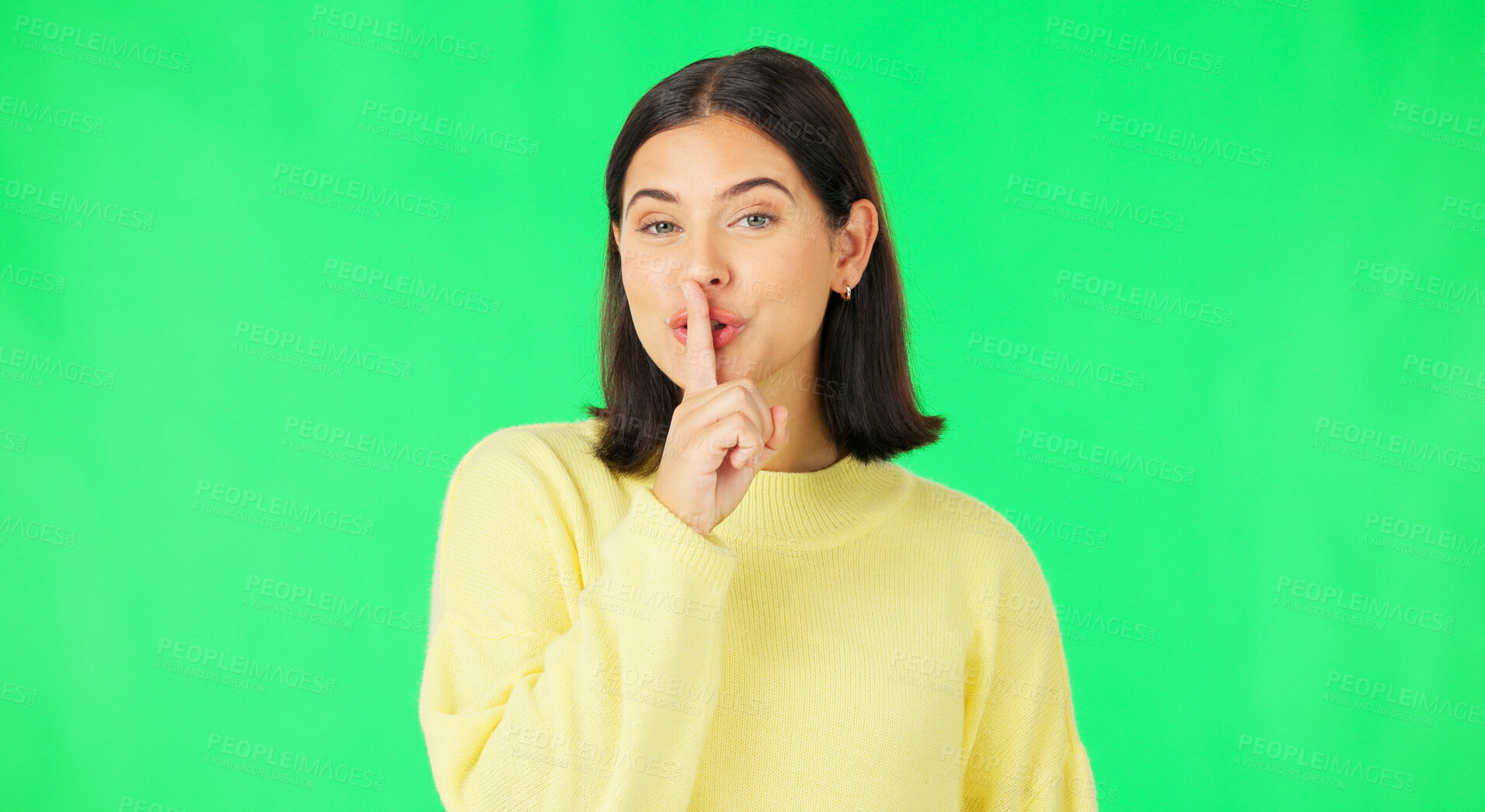 Buy stock photo Portrait, woman and secret with gesture in studio on green background in mock up for discount. Female model, confident and thinking with face, hand or gossip for news, opportunity or sale with sign