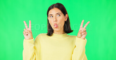 Buy stock photo Green screen, funny face and happy woman with peace sign tongue out and crazy in studio. Comedy, female model and silly with v emoji hand sign with gen z fashion and style with confidence of girl