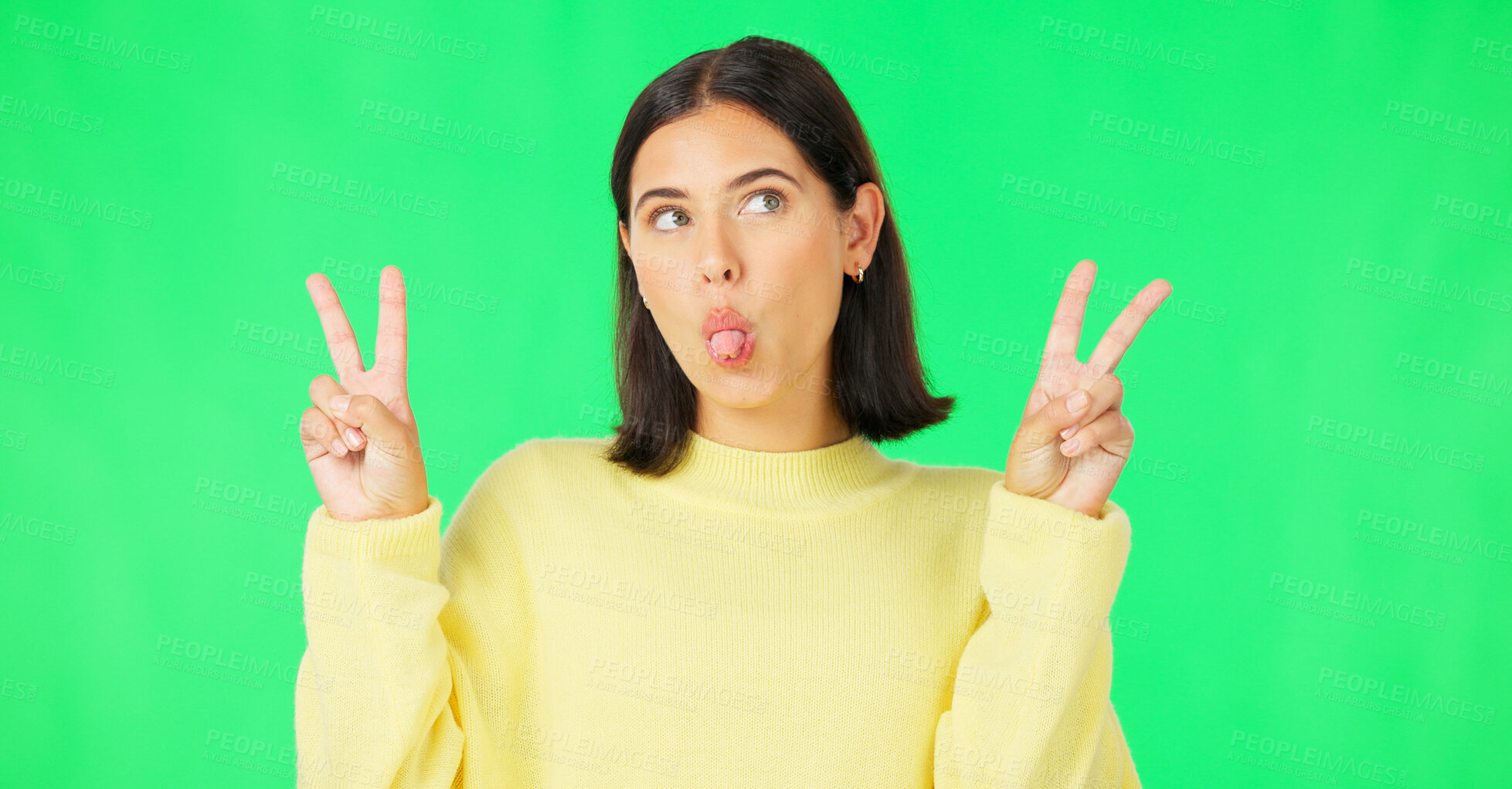 Buy stock photo Green screen, funny face and happy woman with peace sign tongue out and crazy in studio. Comedy, female model and silly with v emoji hand sign with gen z fashion and style with confidence of girl