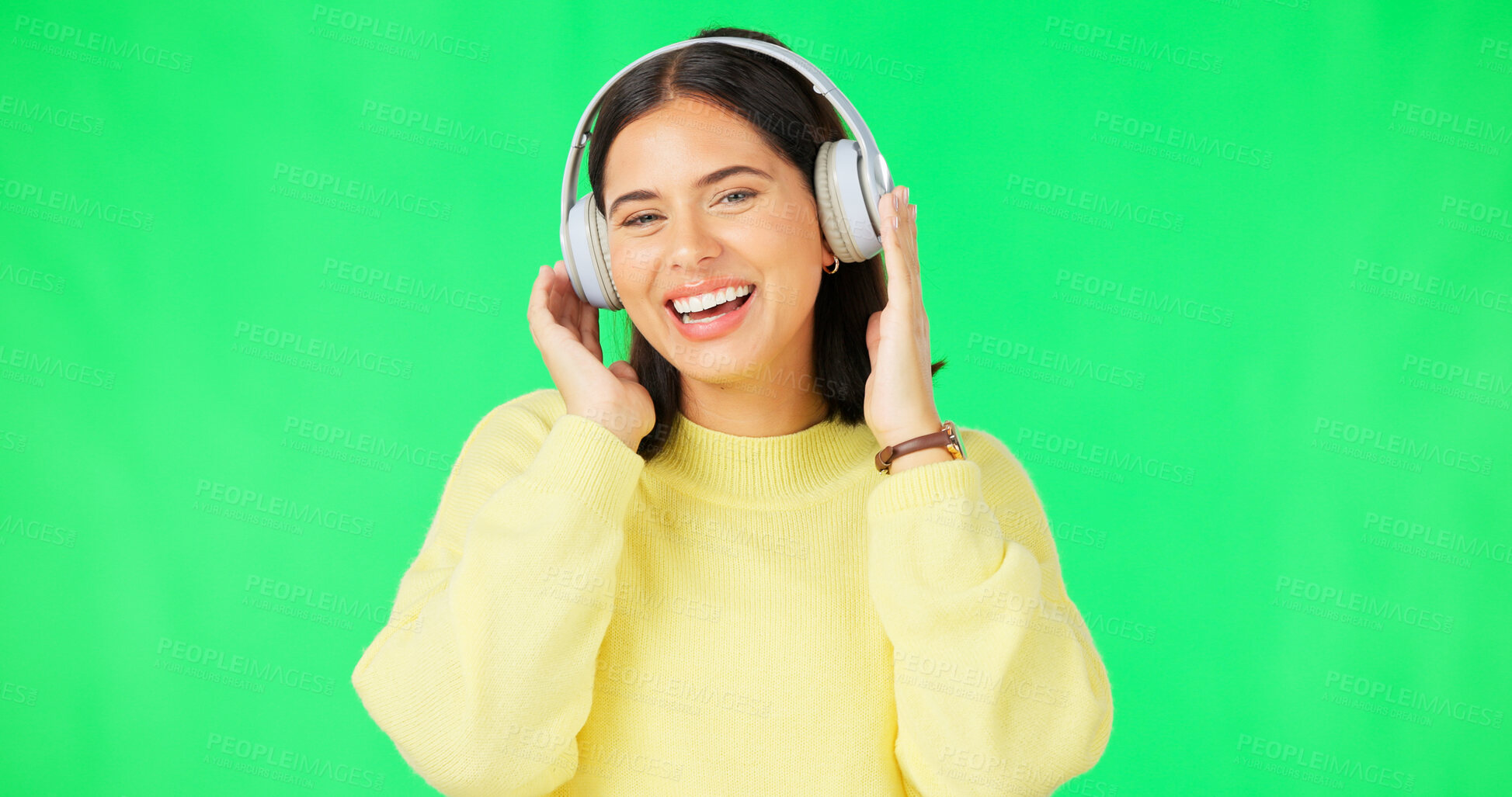 Buy stock photo Green screen, portrait and woman with music headphones for podcast, streaming and hearing audio sound on studio background. Happy young model listening to multimedia, song and subscription on radio