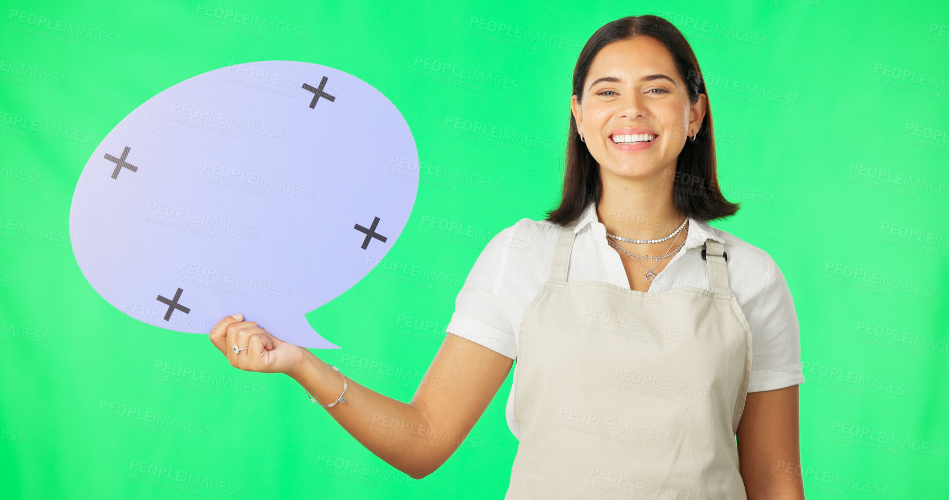 Buy stock photo Female, person and smile with speech bubble in studio for mock up on green screen for offer in portrait. Woman, barista and apron for restaurant with announcement, social media or discount on cafe