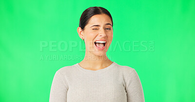Buy stock photo Happy woman, portrait and wink with smile on green screen in studio with mock up announcement. Female, person or entrepreneur with excitement for suggestion, promotion or offer in sale of product