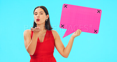 Buy stock photo Woman, speech bubble and kiss in studio portrait, makeup and feedback for valentines day by blue background. Girl, pout emoji and poster with tracking markers for love, mockup space or quote on promo