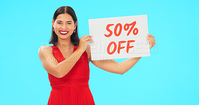 Buy stock photo Portrait, woman and sale with discount  sign and studio mock up in retail on blue background. Female model, person and smile in happiness in offer for customer in beauty, cosmetics or fashion 