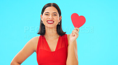 Buy stock photo Portrait, smile and woman with paper heart in studio isolated on a blue background mockup space. Face, romance and happy model with love sign for anniversary, emoji and valentines day gift or present