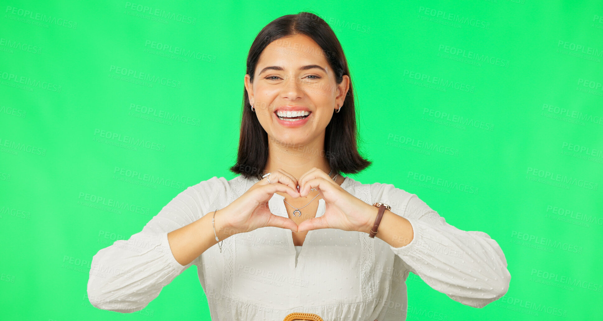 Buy stock photo Portrait, heart hands and woman with green screen, feedback and review on a studio background. Face, happy person and model with promotion, symbol for love and kindness with icon, emoji and support