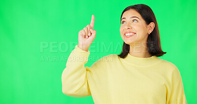 Buy stock photo Smile, advertising and woman on green screen pointing up to sales on mockup space isolated on studio background. Model, hands sign and promotion, marketing presentation and commercial offer for deal