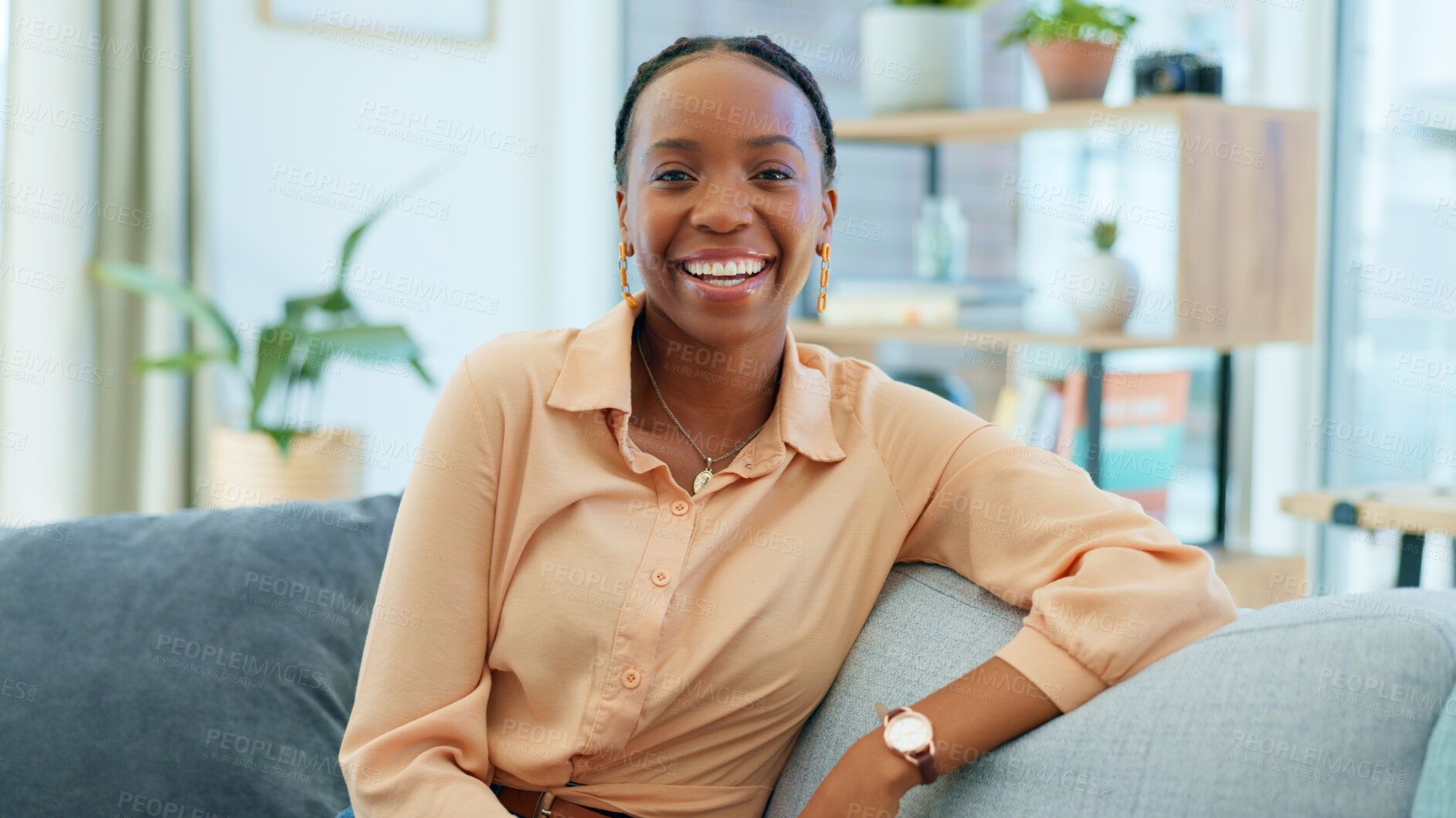 Buy stock photo Smile, black woman and portrait on the sofa in house as homeowner, real estate investor or mortgage loan buyer. Young, happy or an African person on living room couch or apartment property furniture