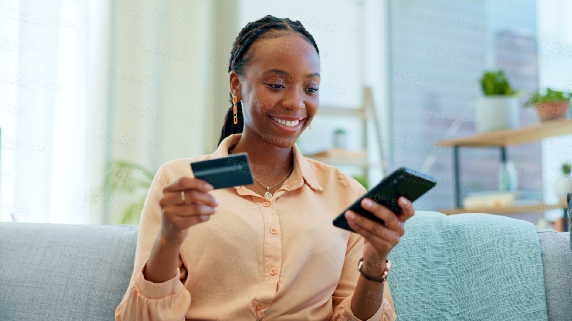 Buy stock photo Happy black woman, phone and credit card on sofa for payment, online shopping or fintech at home. African female person smile with debit and mobile smartphone for transaction, bank app or ecommerce