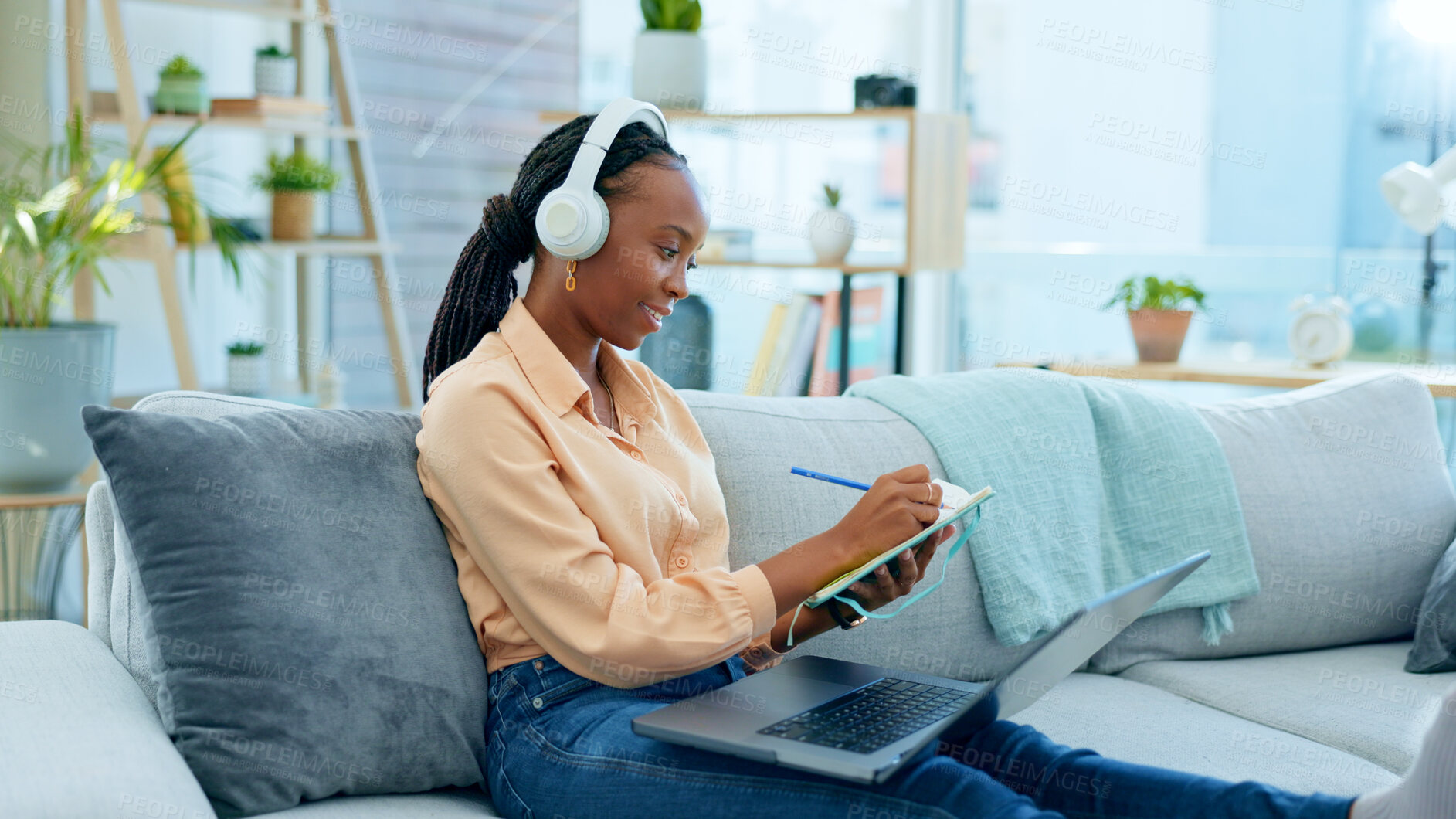 Buy stock photo Video call, laptop and black woman doing remote work on couch in a home  writing notes in webinar or e learning. Sofa, information and student working with online technology in apartment for research