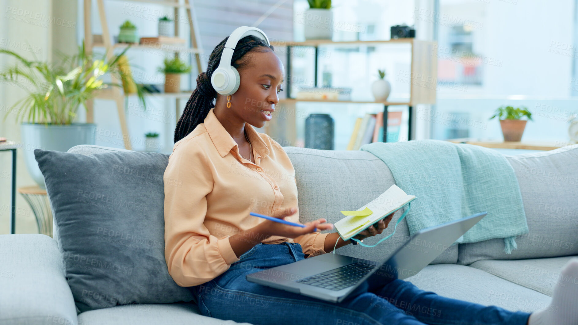 Buy stock photo African woman, student and laptop for online course on sofa, headphones and notes with thinking in home. Girl, reading and ideas with notebook, computer or headphones for study on video call on couch