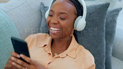 Black woman, headphones or dancing on house sofa to fun, carefree or freedom audio in relax living room. Smile, happy or dancer listening to music, radio or streaming media podcast on home furniture