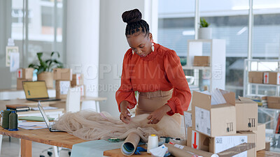 Black woman, designer and fabric cloth for fashion in studio with delivery, logistics or boxes at job. Design expert, material inspection and texture check for vision, pattern and clothes in workshop