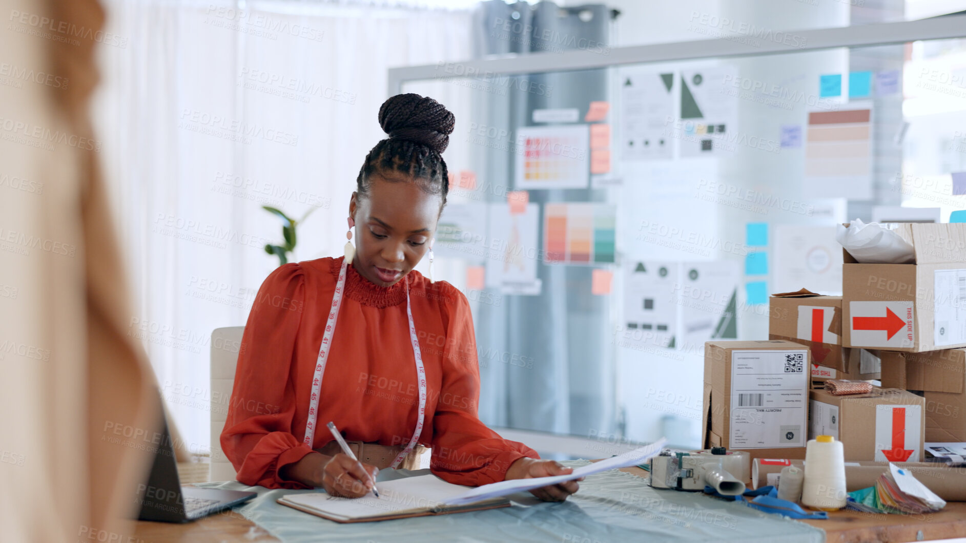 Buy stock photo Fashion, designer and black woman with checklist for delivery, logistics and ecommerce in workshop. Retail, boutique and person with boxes for creative startup, small business and supply chain