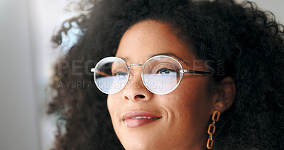 Face portrait of a satisfied business woman reading emails on a computer. Isolated closeup of designer at a workstation. Smiling African American female looking a display or watching content.