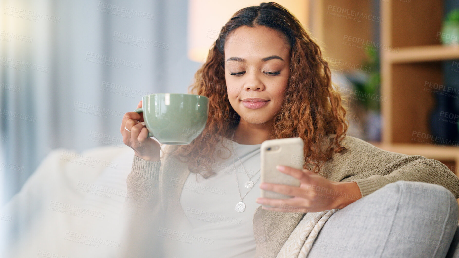 Buy stock photo Woman, phone and coffee on sofa, relax and reading notification for web chat, blog and contact in home. Girl, smartphone and thinking for online date, social media app and drink tea on lounge couch
