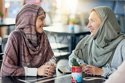 Buy stock photo Friends, happy and Muslim women in cafe, bonding and talking together. Coffee shop, relax and Islamic girls, group or people chat, conversation and discussion for social gathering in restaurant.