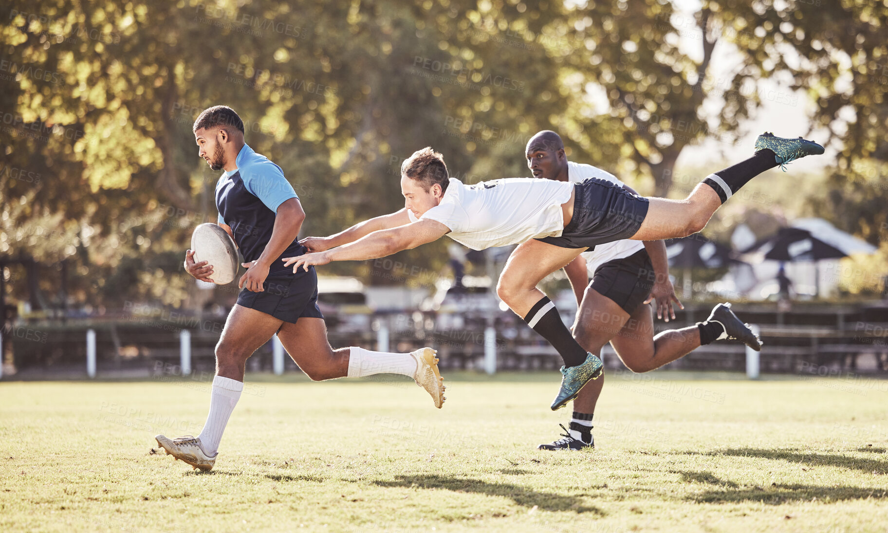 Buy stock photo Sports, rugby and men in action on field for match, practice and game in tournament or competition. Fitness, teamwork and strong players tackle for exercise, training and performance to win ball