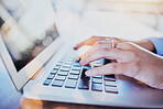 Hands, laptop and keyboard with person typing or writing article on computer or on the internet for research. Copywriting, seo and employee on the web or copywriting on pc with wifi connection 