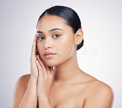 Buy stock photo Skin, hands on face and beauty of a woman in studio for glow, dermatology and cosmetics. Portrait of aesthetic female person with natural shine, facial skincare and wellness on a white background