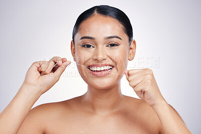 Buy stock photo Happy woman, portrait and dental floss for clean teeth, hygiene or healthcare against a white studio background. Female person or model smiling in flossing, tooth cleaning or oral, gum and mouth care