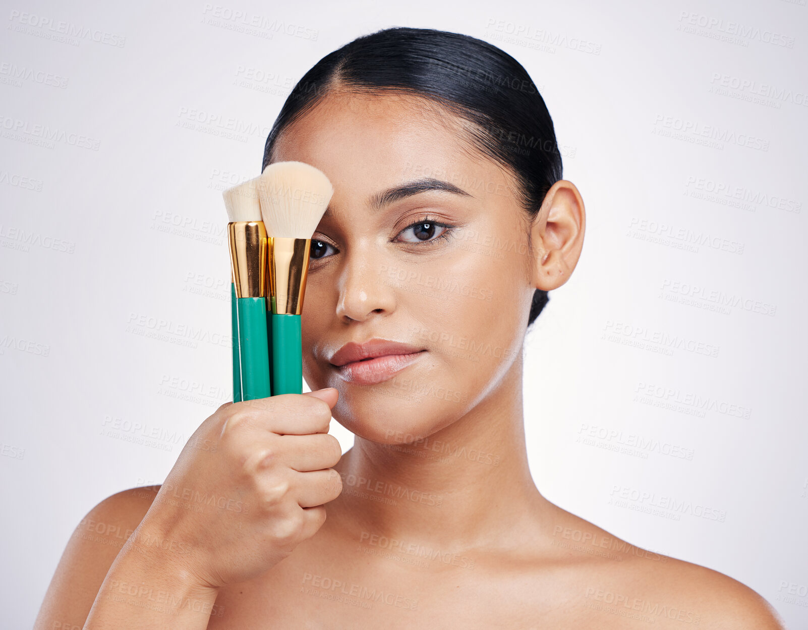 Buy stock photo Makeup brush, face and beauty with woman in portrait, foundation product and powder isolated on studio background. Female model, natural cosmetics and skin glow with cosmetic tools and cosmetology