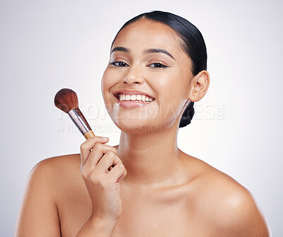 Buy stock photo Makeup brush, woman with smile in portrait and beauty, foundation and powder isolated on studio background. Female model, face with natural cosmetics and skin glow with cosmetic tools and cosmetology