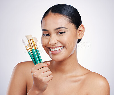 Buy stock photo Makeup brushes, face and beauty, woman with smile, foundation and powder isolated on studio background. Female model in portrait, natural cosmetics and skin glow with cosmetic tools and cosmetology