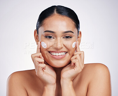 Buy stock photo Happy woman, portrait and smile with cream for skincare, moisturizer or cosmetics against a white studio background. Female person or model smiling for beauty skin product, lotion or facial treatment