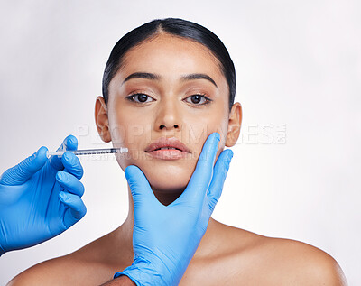 Buy stock photo Woman, studio and needle in portrait, surgery or cosmetics for skin, facial or collagen by white background. Girl cosmetic surgeon and filler on face, syringe or hands for beauty, skincare or change