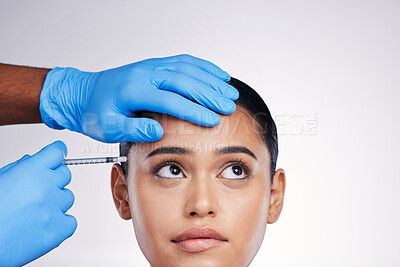 Buy stock photo Woman, studio and needle with hands, surgery or worry with thinking, doubt or collagen by white background. Girl cosmetic surgeon and filler with ideas, mistake or fear for beauty, skincare or change