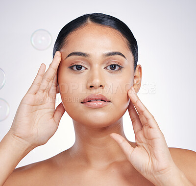 Buy stock photo Beauty, natural and woman with hands on face in studio for glow,  skin dermatology or cosmetic. Portrait of aesthetic model person with bubbles for self care, facial or skincare on a white background