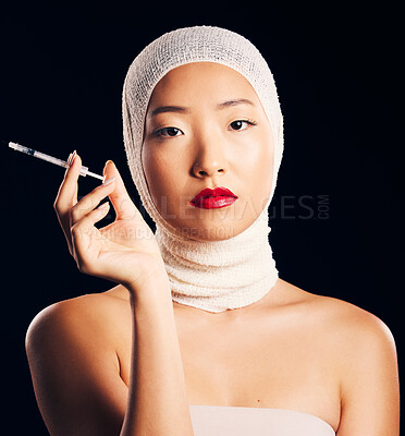 Buy stock photo Woman, portrait and plastic surgery with syringe, bandage and studio background with asian beauty for filler. Female person, face and cosmetology with injection for skin, collagen and treatment.