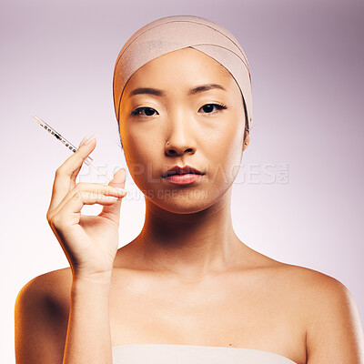 Buy stock photo Woman, portrait and plastic surgery with injection, bandage and asian model in studio background. Serious woman, syringe and face with collagen for aesthetic, cosmetics and facial beauty treatment.