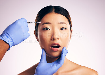 Buy stock photo Face skincare, injection surprise and Asian woman in studio isolated on a white background. Cosmetics, syringe and female model with collagen filler, portrait and wow for facelift plastic surgery.
