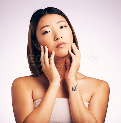 Buy stock photo Serious, face portrait and skincare of Asian woman in studio isolated on white background. Natural, beauty and female model with makeup, cosmetics and spa facial treatment for healthy skin aesthetic.