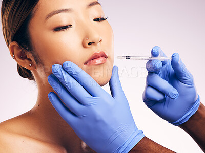 Buy stock photo Lips injection, skincare and Asian woman with cosmetics in studio isolated on white background. Plastic surgery, syringe and female model with lip filler for dermatology, facelift treatment or beauty