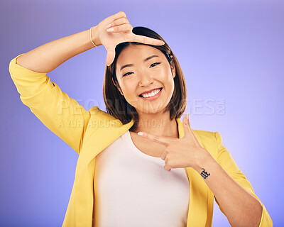 Buy stock photo Portrait, frame and Asian woman with a smile, selfie and happy against a studio background. Face, female person or photographer with hand gesture, moment and creative perspective and finger framing