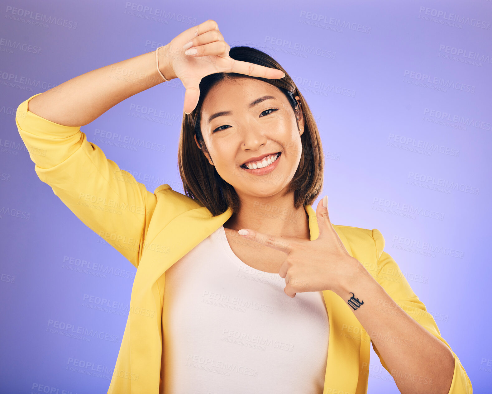 Buy stock photo Portrait, frame and Asian woman with a smile, selfie and happy against a studio background. Face, female person or photographer with hand gesture, moment and creative perspective and finger framing