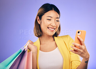 Buy stock photo Asian woman, selfie and shopping bag in studio with smile for deal, sale or discount by backdrop. Japanese influencer girl, retail and happy with social media, contact and luxury by purple background