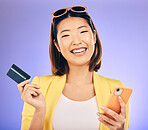 Cellphone, card and portrait of a woman in studio for online shopping with positive mindset. Happy, smile and Asian female model with internet banking for paying bills with phone by purple background